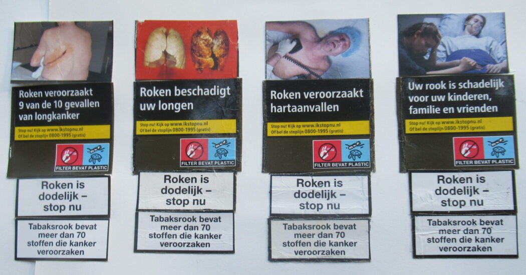 Roken veroorzaakt 9 van de 10 gevallen van longkanker, Roken beschadigt uw longen, Roken veroorzaakt hartaanvallen, Uw rook is schadelijk voor uw kinderen, familie en vrienden – foto van pakjes kankerstokken door Robert Castermans Roken veroorzaakt 9 van de 10 gevallen van longkanker, Roken beschadigt uw longen, Roken veroorzaakt hartaanvallen, Uw rook is schadelijk voor uw kinderen, familie en vrienden – foto van pakjes kankerstokken door Robert Castermans